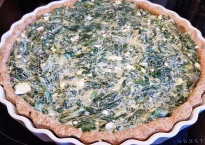 pour the spinach mix in the pie crust