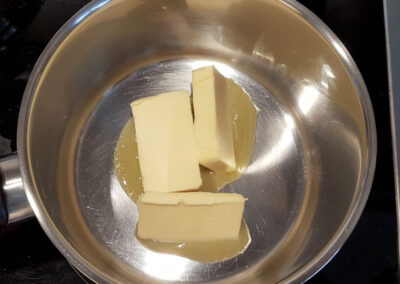 Preparing the bechamel sauce, melting the butter